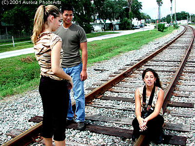 Three of my models taking a break during a shoot back on September 9, 2001. The model sitting down with the camera has my original 35MM film SLR, which I turned pro on a year before. I took this with one of my first digital cameras. This was a fun day!