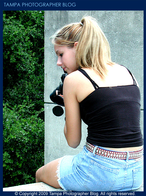 Teen model Roxy, who was helping me out with a client shoot back in 2002, takes a break with my 35 MM SLR film camera, which was barely used in this shoot, as I had transitioned to digital photography by then.
